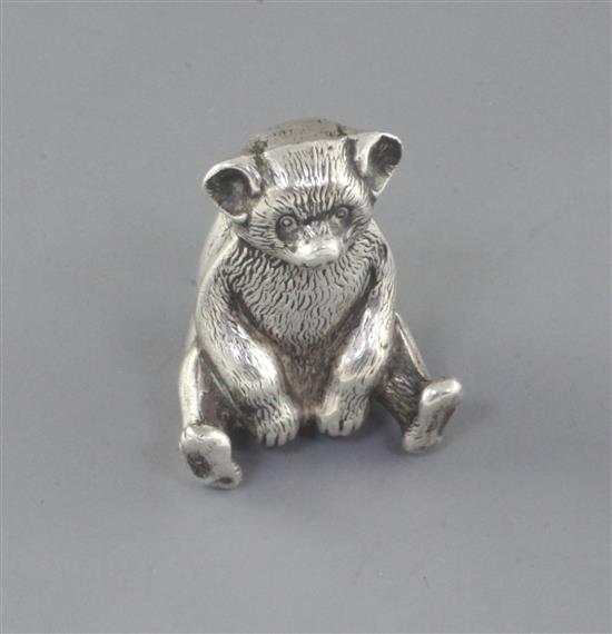 An Edwardian novelty silver pin cushion, modelled as a seated bear, Boots Pure Drug Company, 38mm.